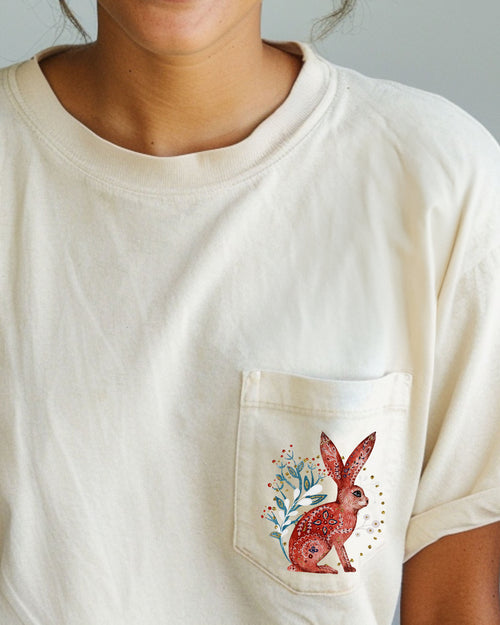 Christmas Rabbit Santa Pocket Folk Art Floral Snow Winter Noel Vintage Inspired Comfort Colors Tee