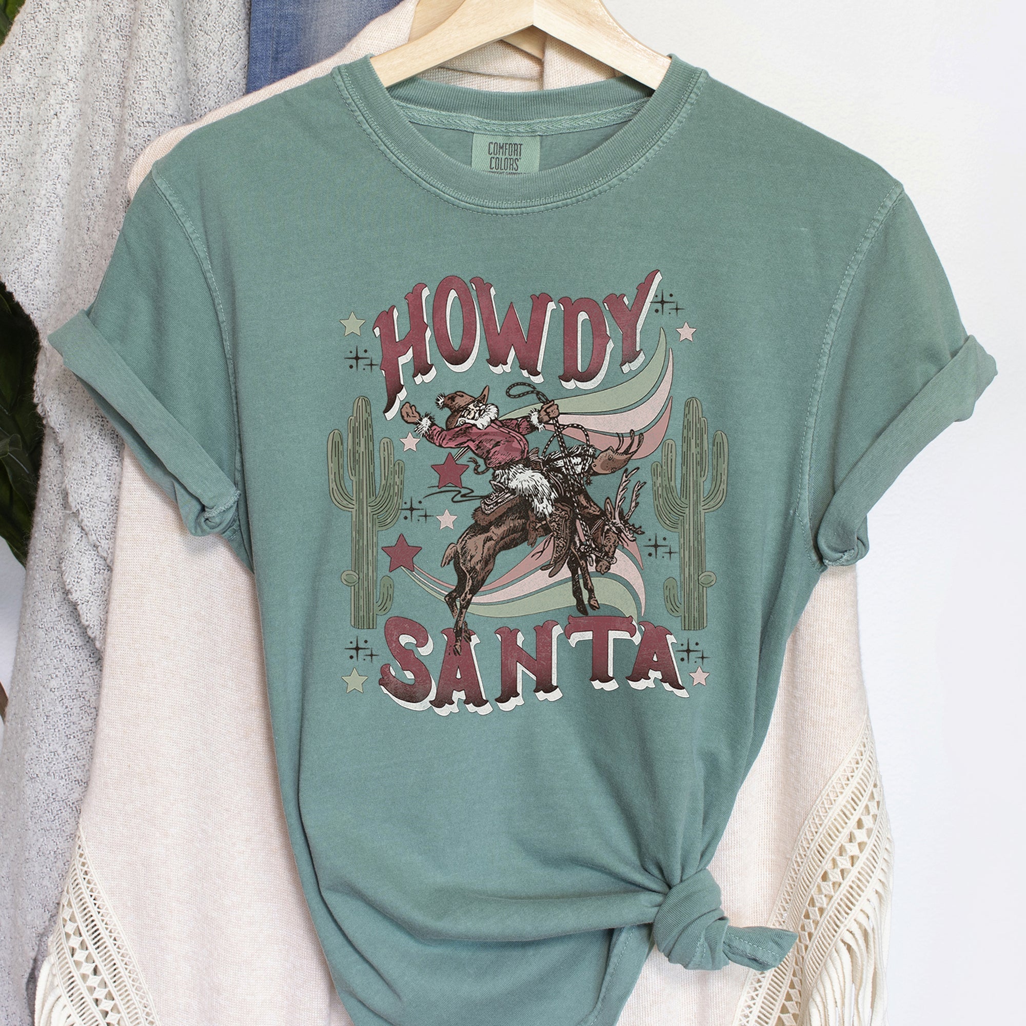 Howdy Santa Cowboy Reindeer Rodeo Desert Cactus Christmas Western Frontier Holiday Vintage Vibe Comfort Colors Tee