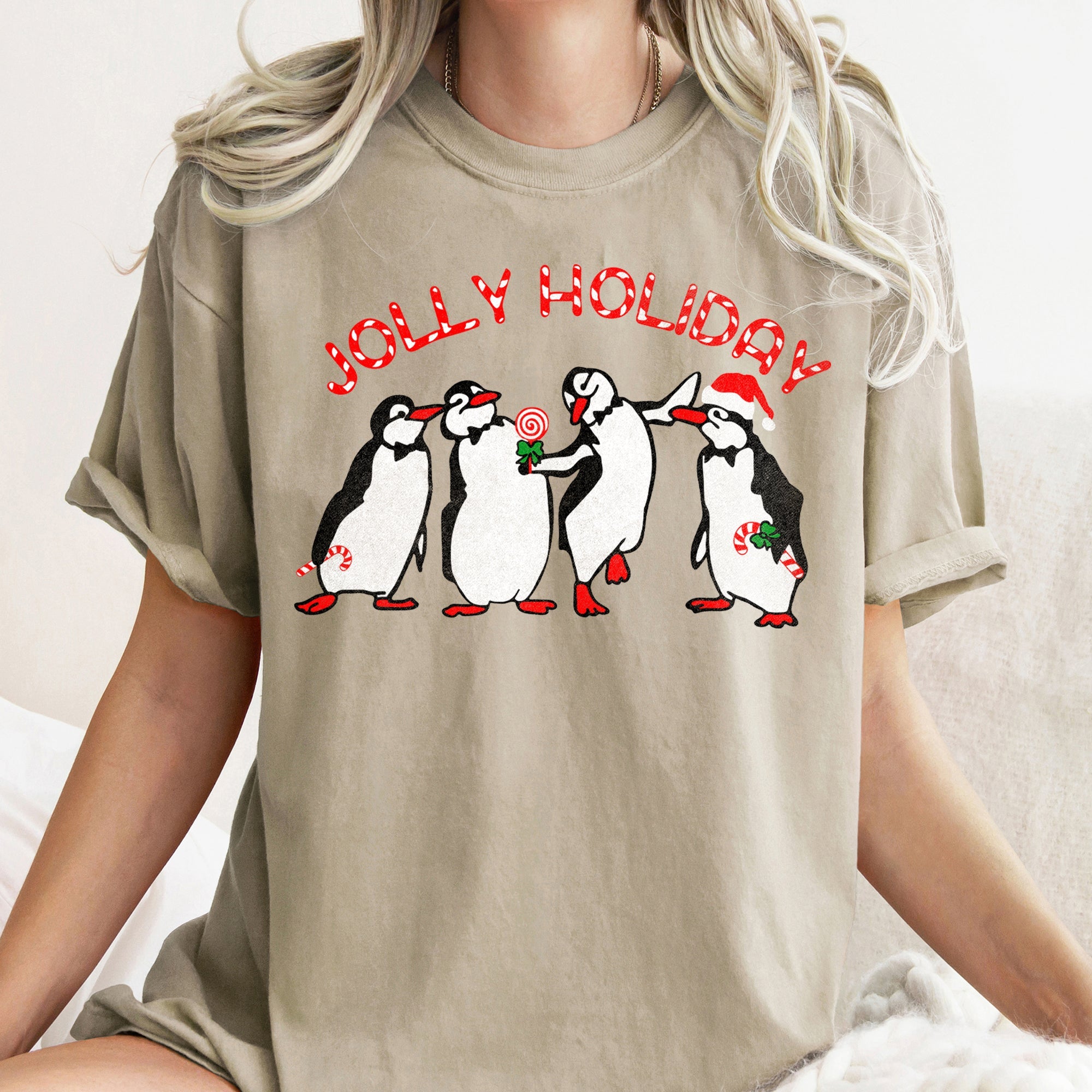 Jolly Holiday Penguins Christmas Parade In Cozy Winter Village Scene With Snowflakes And Cheer Comfort Colors Tee