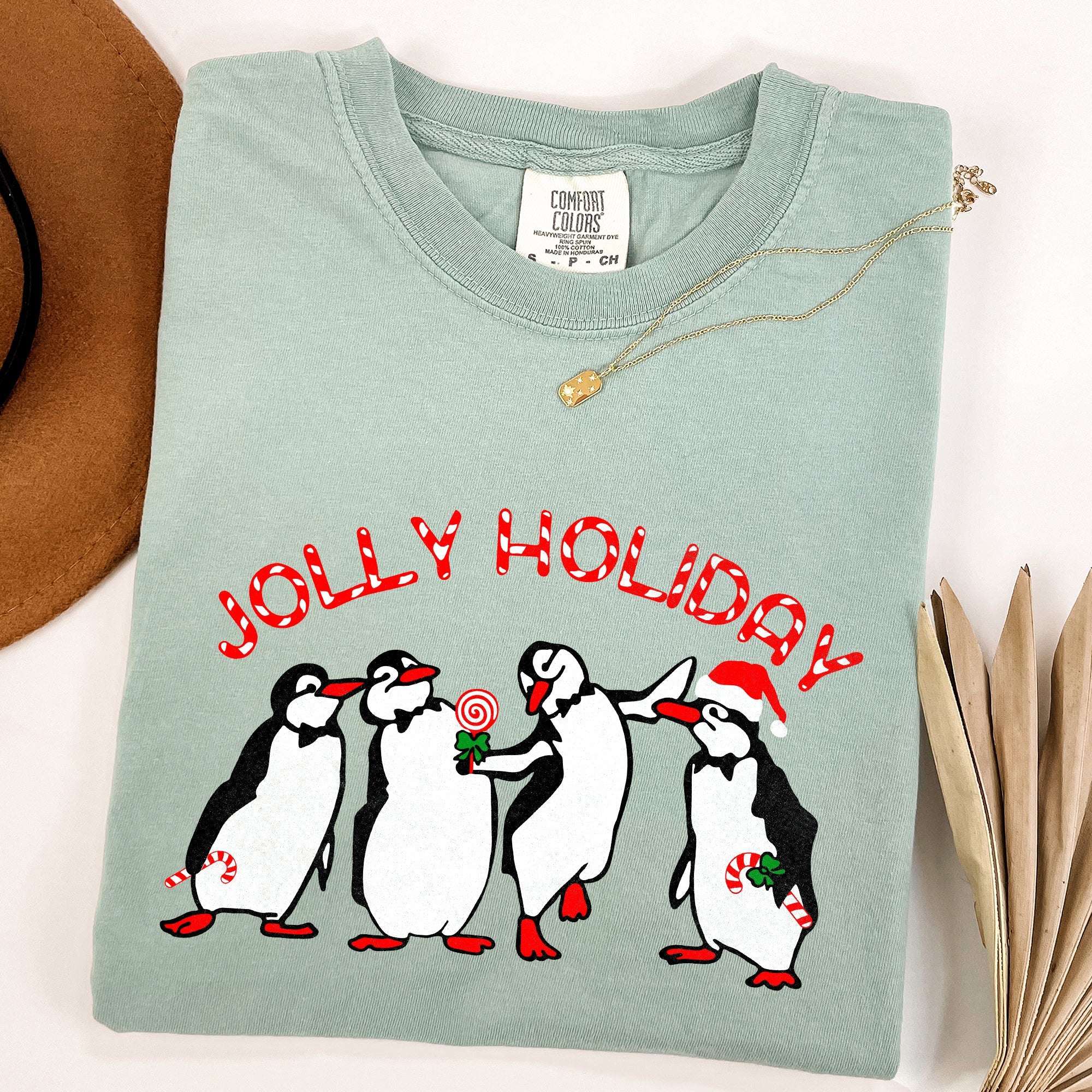 Jolly Holiday Penguins Christmas Winter Santa Claus Scene Vintage Graphic Comfort Colors Tee