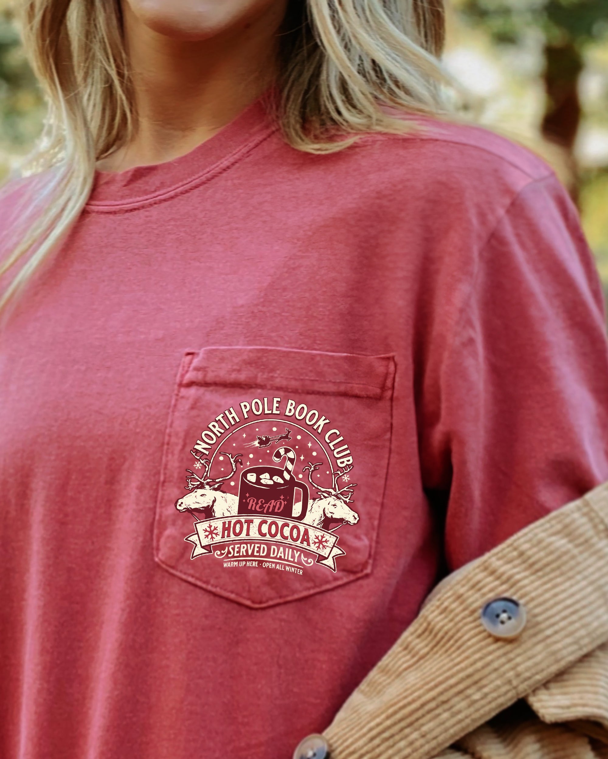 North Pole Book Club Pocket Hot Cocoa Christmas Winter Snow Reindeer Santa Xmas Comfort Colors Tee