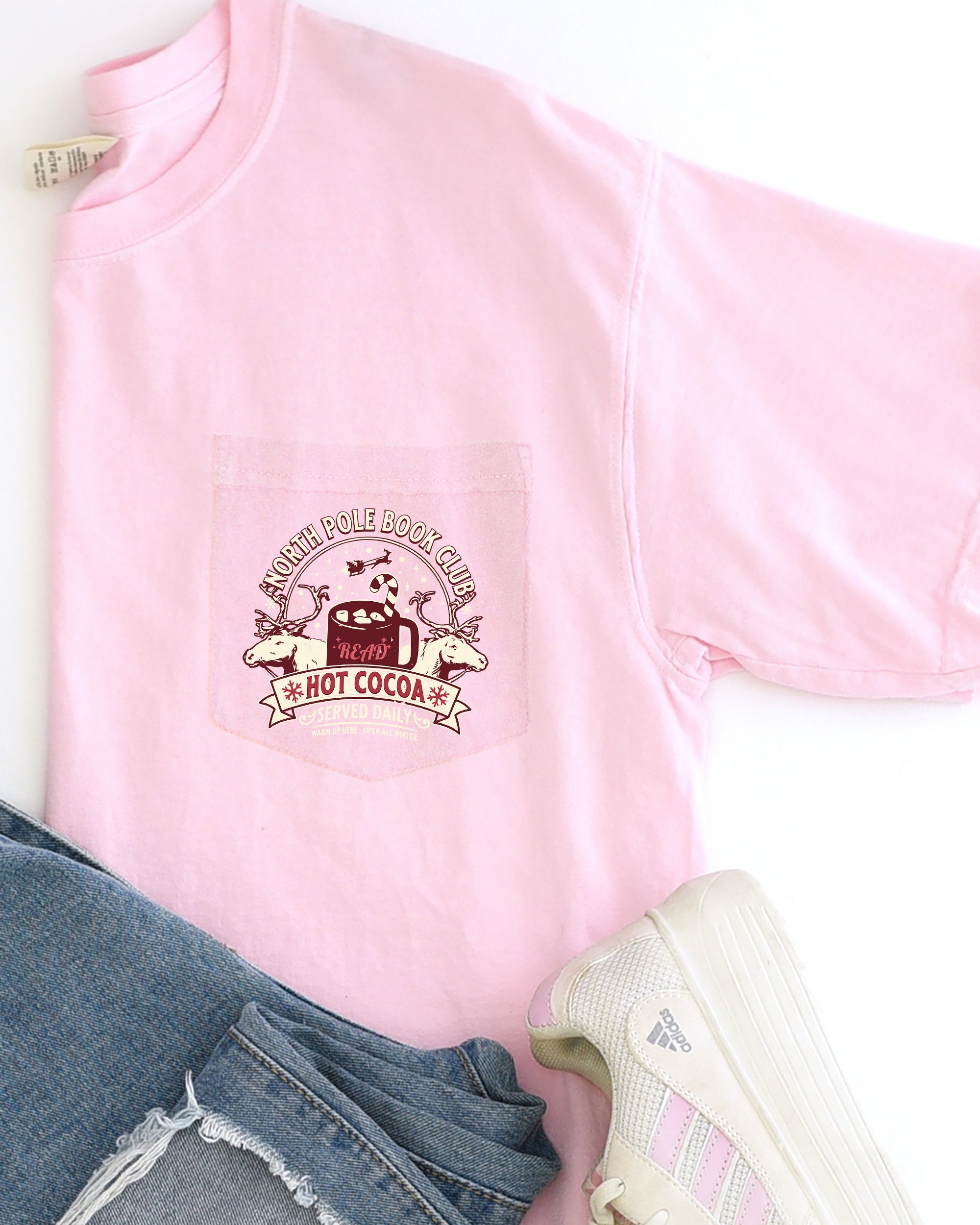 North Pole Book Club Pocket Hot Cocoa Christmas Winter Snow Reindeer Santa Xmas Comfort Colors Tee