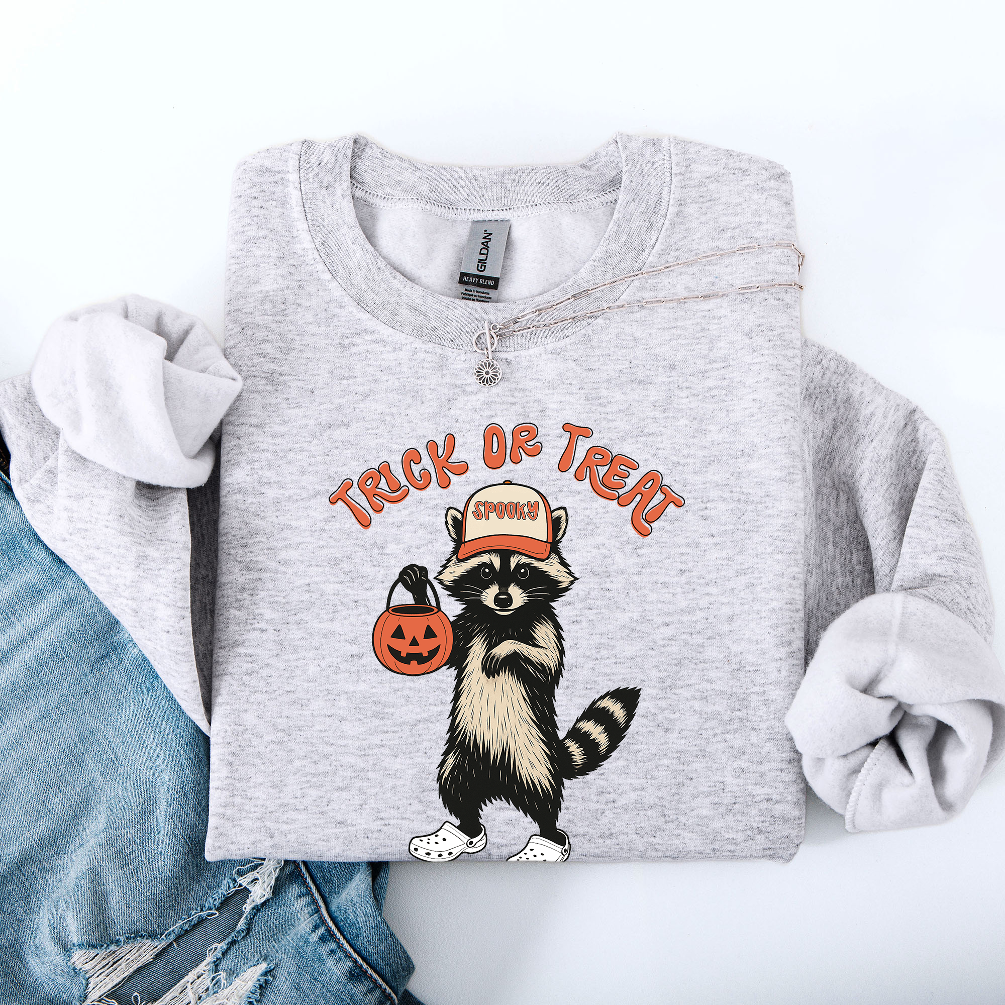 Raccoon Trick Or Treat Halloween Spooky Cozy Nighttime Autumn Theme Seasonal Fun Sweatshirt