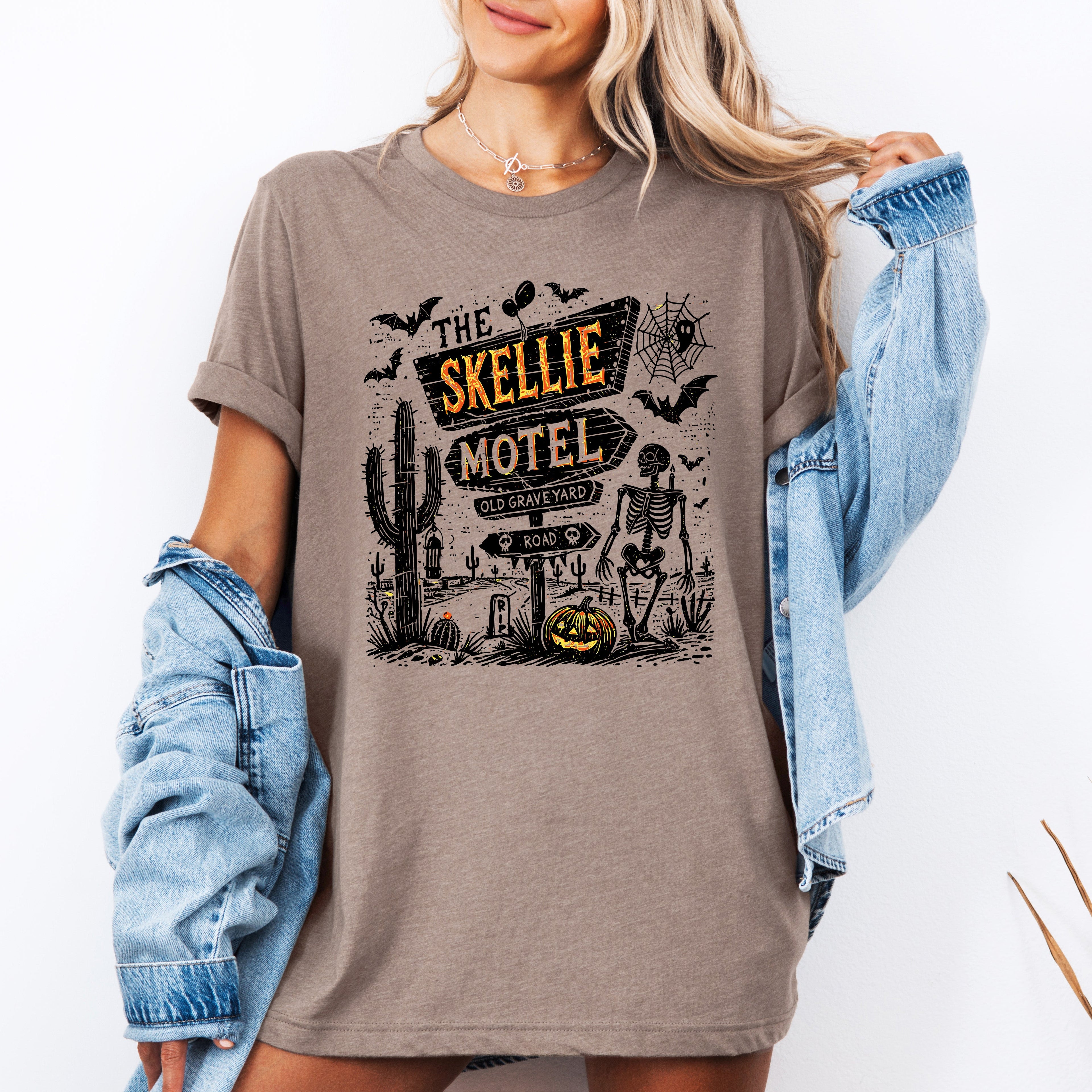 The Skellie Motel Graphic Tee Featuring Skeleton Halloween Artwork Perfect For Spooky Season