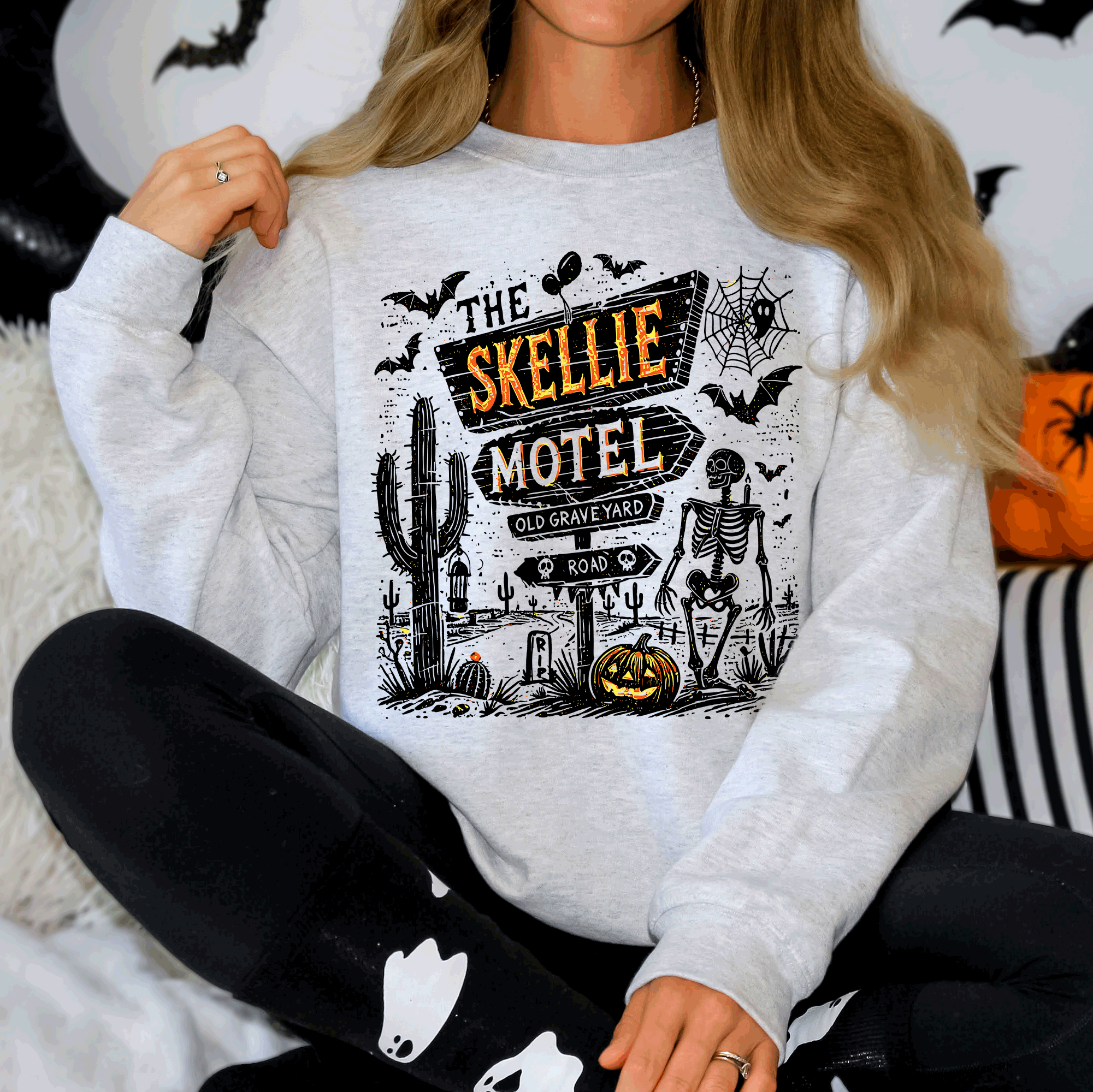 The Skellie Motel Skeleton Halloween Night Haunting Edition With Spooky Vibes And Retro Motel Aesthetic Sweatshirt
