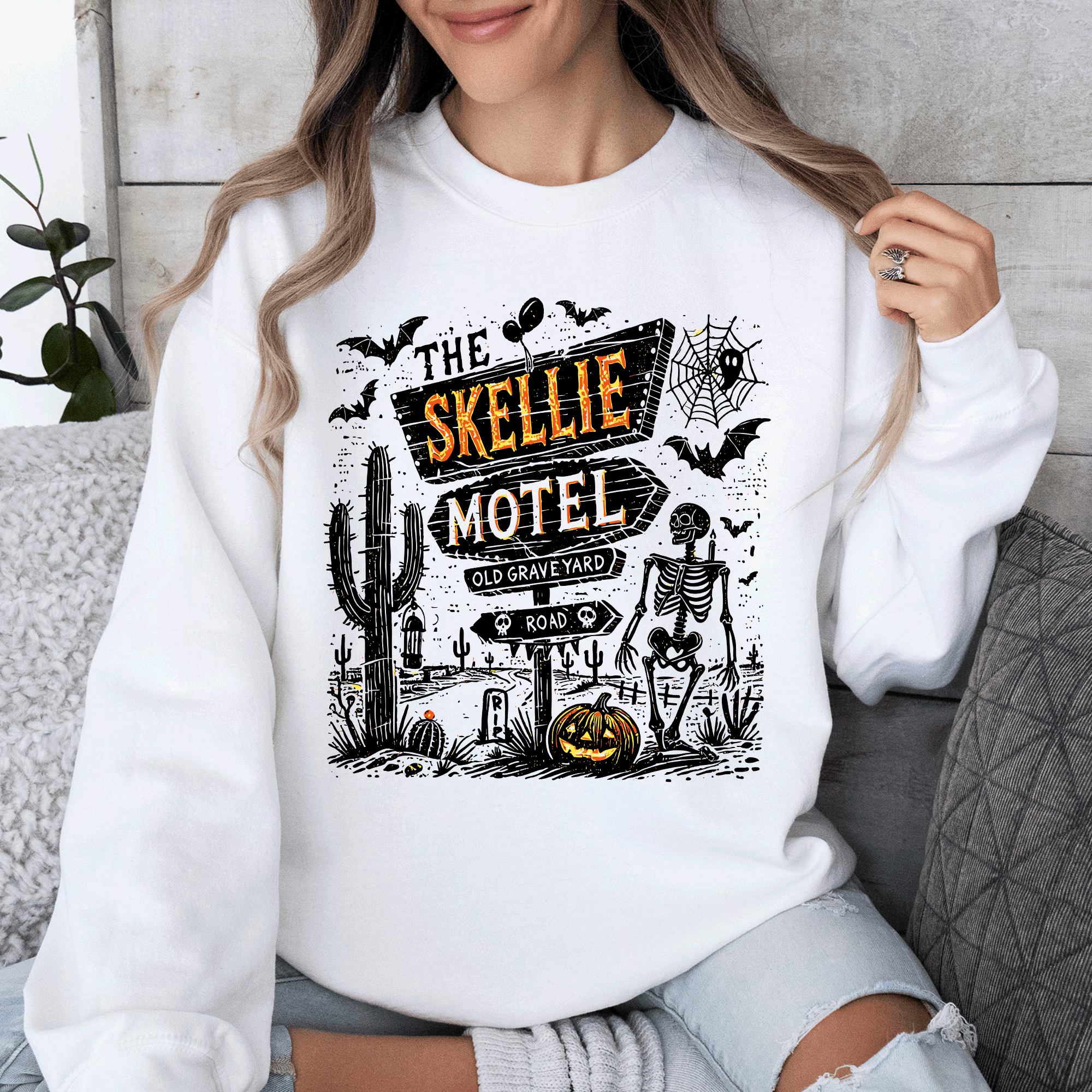 The Skellie Motel Skeleton Halloween Night Haunting Edition With Spooky Vibes And Retro Motel Aesthetic Sweatshirt