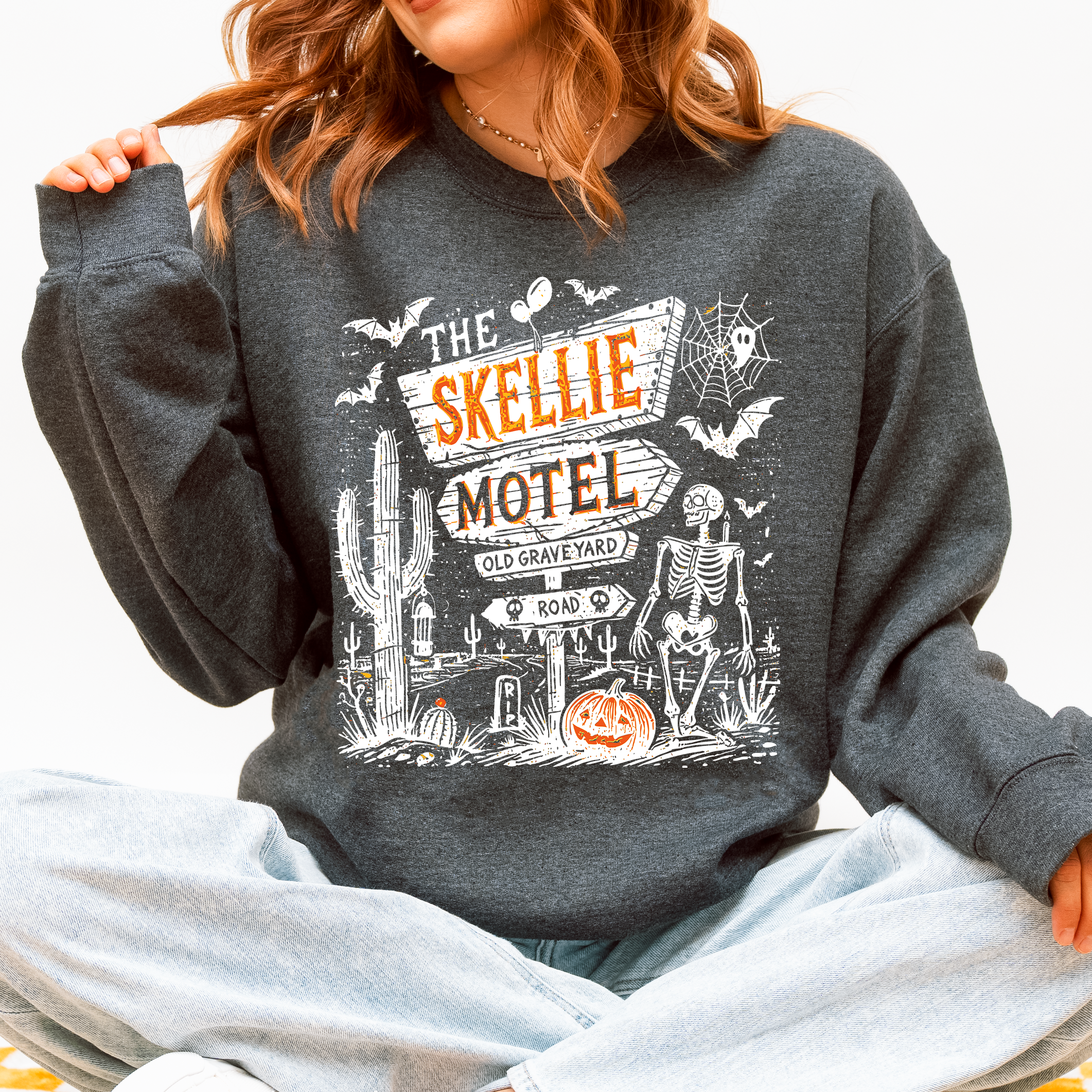 The Skellie Motel Skeleton Halloween Night Haunting Edition With Spooky Vibes And Retro Motel Aesthetic Sweatshirt