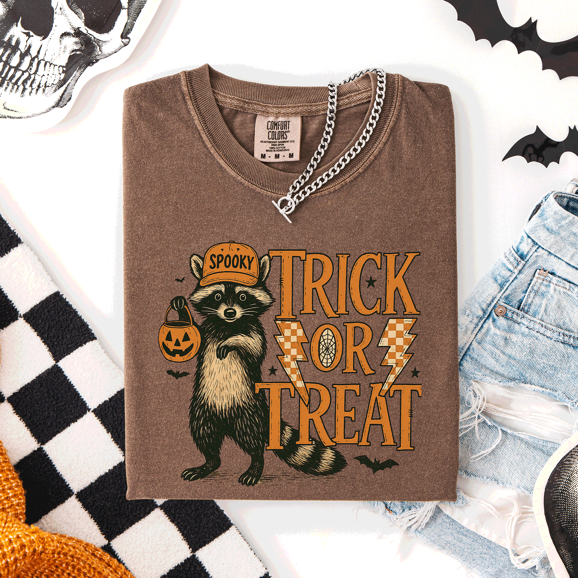Trick or Treat Raccoon Halloween Mischief With Skeletons Ghosts Cats And Pumpkins Comfort Colors Tee